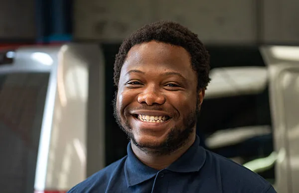 Technician smiling at camera