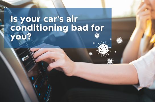 Woman in car with hand over nose and other hand over air con fan